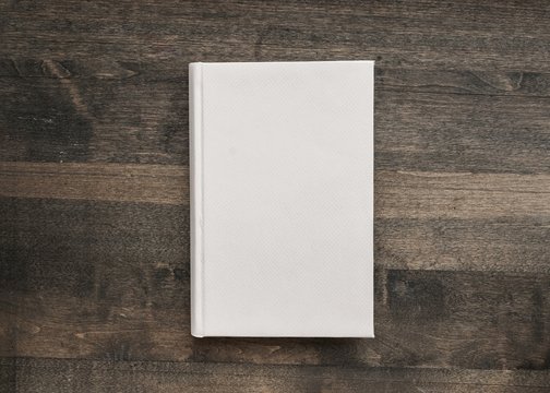 Book. Photo blank book cover on textured wood background