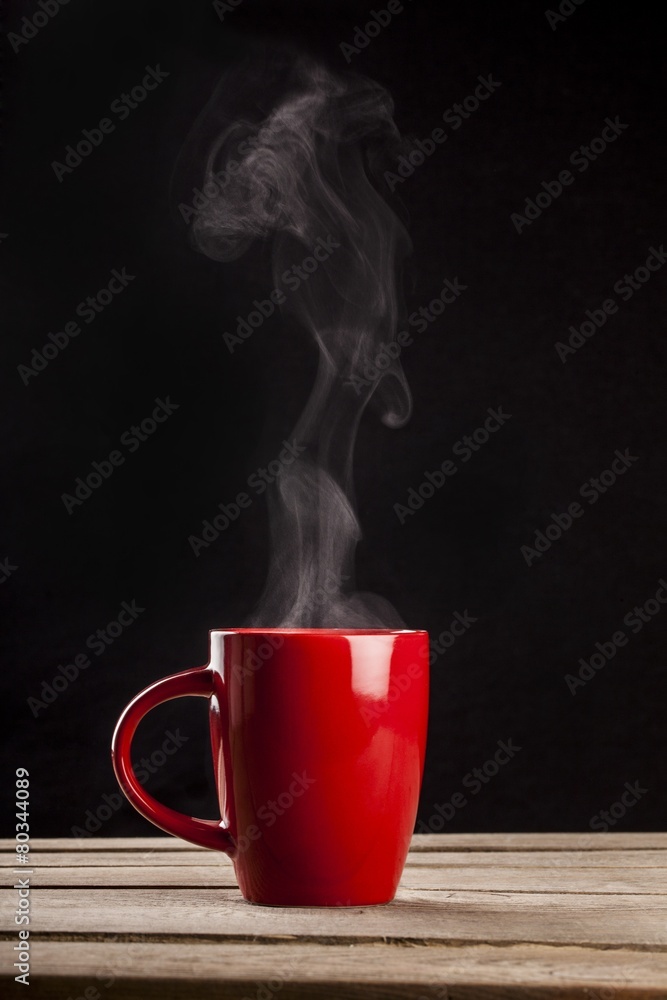 Sticker Aroma. Steaming coffee cup on dark background