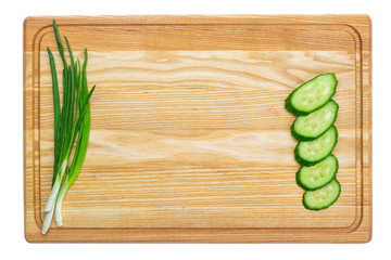 Fresh green onion on wooden board. Isolated on white background