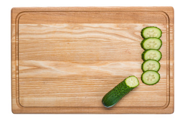 sliced cucumber on a wooden cutting board