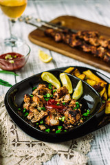 Grilling shashlik on barbecue grill