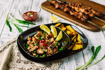 Grilling shashlik on barbecue grill