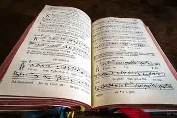 Vintage psalm book with chorus singing notes