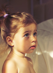 Toned portrait of Little cute girl is afraid