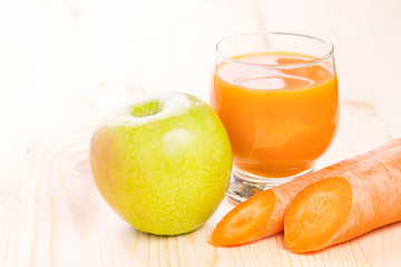 Glass of fresh carrot and apple juice