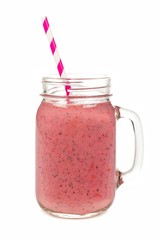 Pink smoothie in jar glass with straw isolated on white