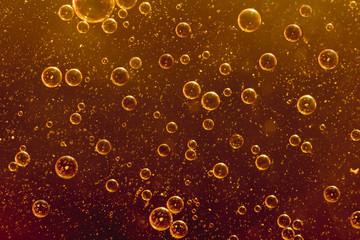 Orange bubbles floating in water
