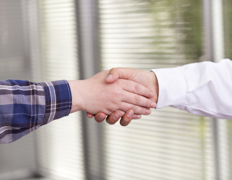 Handshake between doctor and patient
