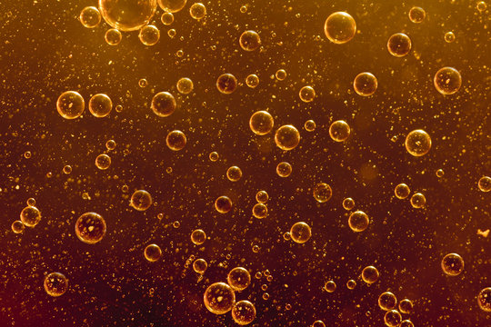 Orange bubbles floating in water