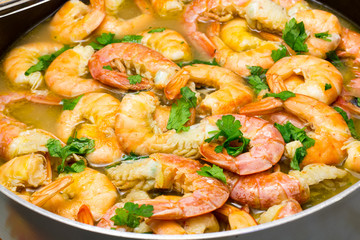 Shrimp cooking with parsley