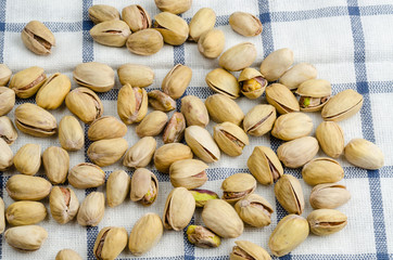 roasted and salted pistachios on table cloth
