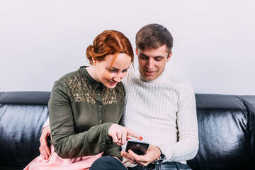 Young couple looking at phone