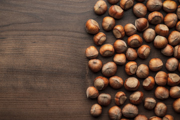 hazelnuts on the brown wooden table