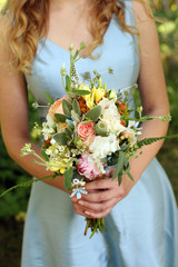 Bridesmaid Holding Bouquet of Flowers on a Wedding Day