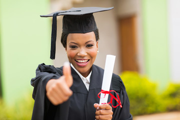 african female graduate giving thumb up