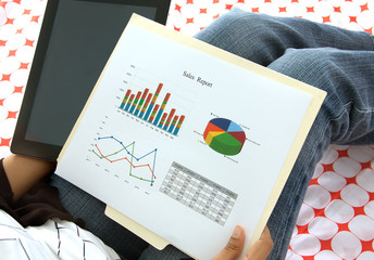 Business executive analyzing corporate data and reports