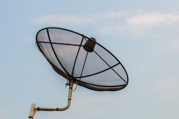 Satellite dish with sky background.