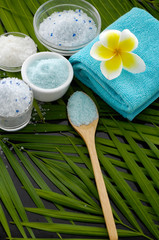 Spa sitting on palm leaf texture