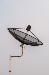 Satellite dish with blue sky background.