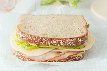 sandwich with ham, cheese and lettuce