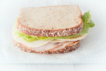sandwich with ham, cheese and lettuce