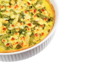 Pie with cheese, asparagus and herbs in baking form