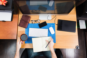 Freelance developer and designer working at home, man using desk