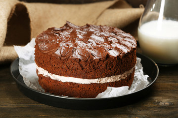Delicious chocolate cake on table close-up