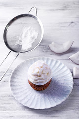 Delicious coconut cupcake with cream