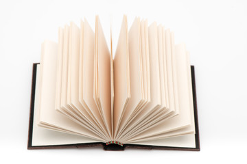 Open book pages in white background, close-up.