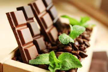 Still life with set of chocolate in wooden box of coffee