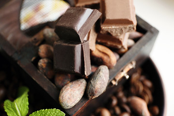 Still life with set of chocolate, nuts and coffee grains,