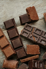 Set of chocolate on wooden table, closeup