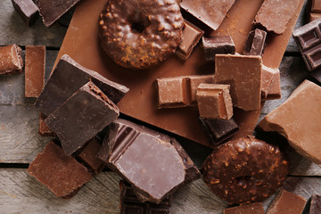Set of chocolate on wooden table, closeup