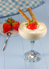 Yogurt dessert with fresh strawberry in a glass