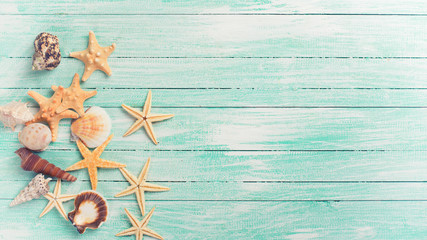 Marine items on wooden background.