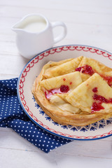 Pancakes or crepes on plate with jam