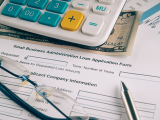 small business loan application on the desk.