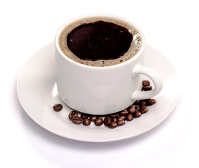 isolated coffee cup and saucer and coffee beans.