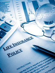 life insurance policy on the desk.
