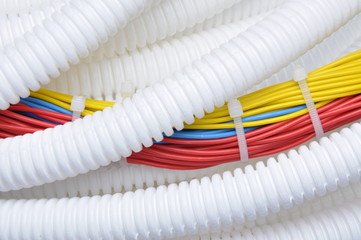 Corrugated pipe with electrical cables