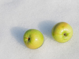 two green ripe apples