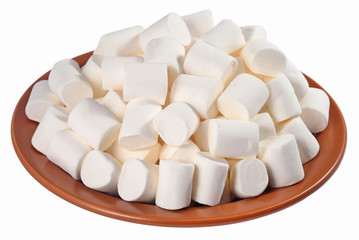 White marshmallow on a ceramic plate on a white