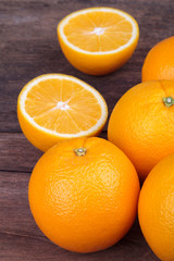 Fresh oranges on wood