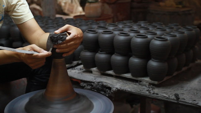Hands making clay pot at Ratchaburi, Thailand