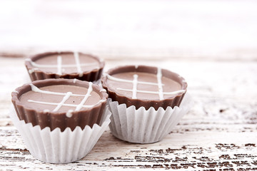 Dark chocolate on wooden background