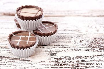 Dark chocolate on wooden background