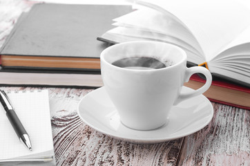 Cup of coffee on a wooden table
