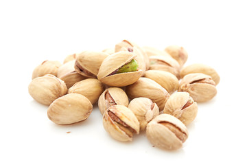 Heap of pistachios nuts isolated on the white