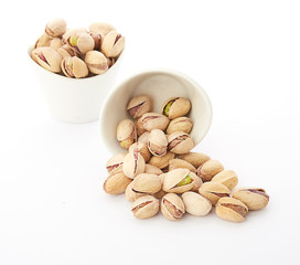 Heap of pistachios nuts isolated on the white